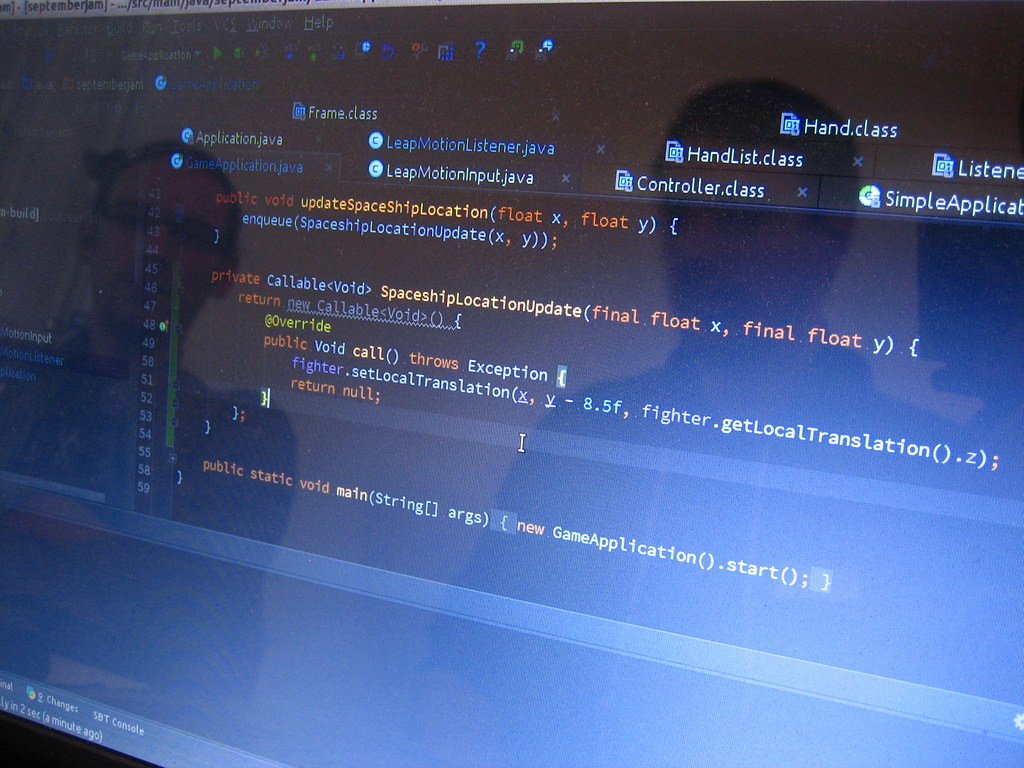 Programmer working on a laptop representing an AI coding assistant