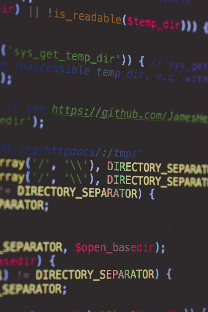 Programmer typing code representing AI coding assistants