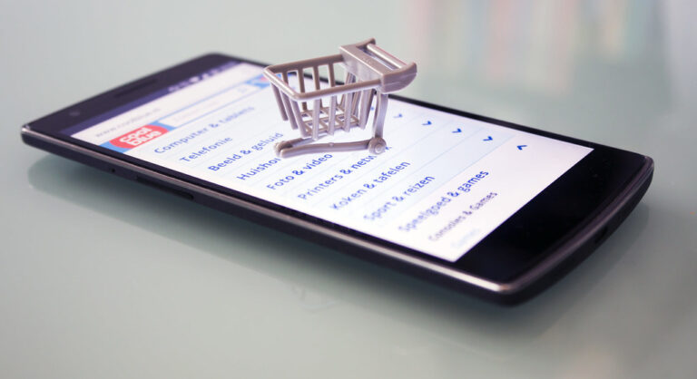 Person browsing an online store checkout page on a laptop